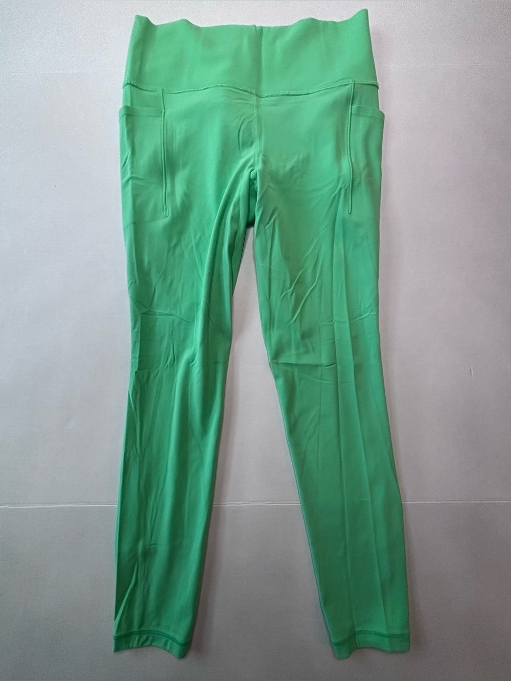 Athleta Bright Green High-Rise Performance Leggings with Side Pockets